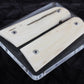 Gun grip with wooden cover on a black background